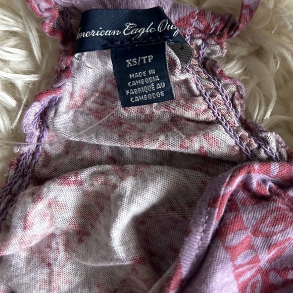 A shirt bundle with 5 tops (sizes include 1- XS, 3- smalls, and 1- medium) - Picture 5 of 11